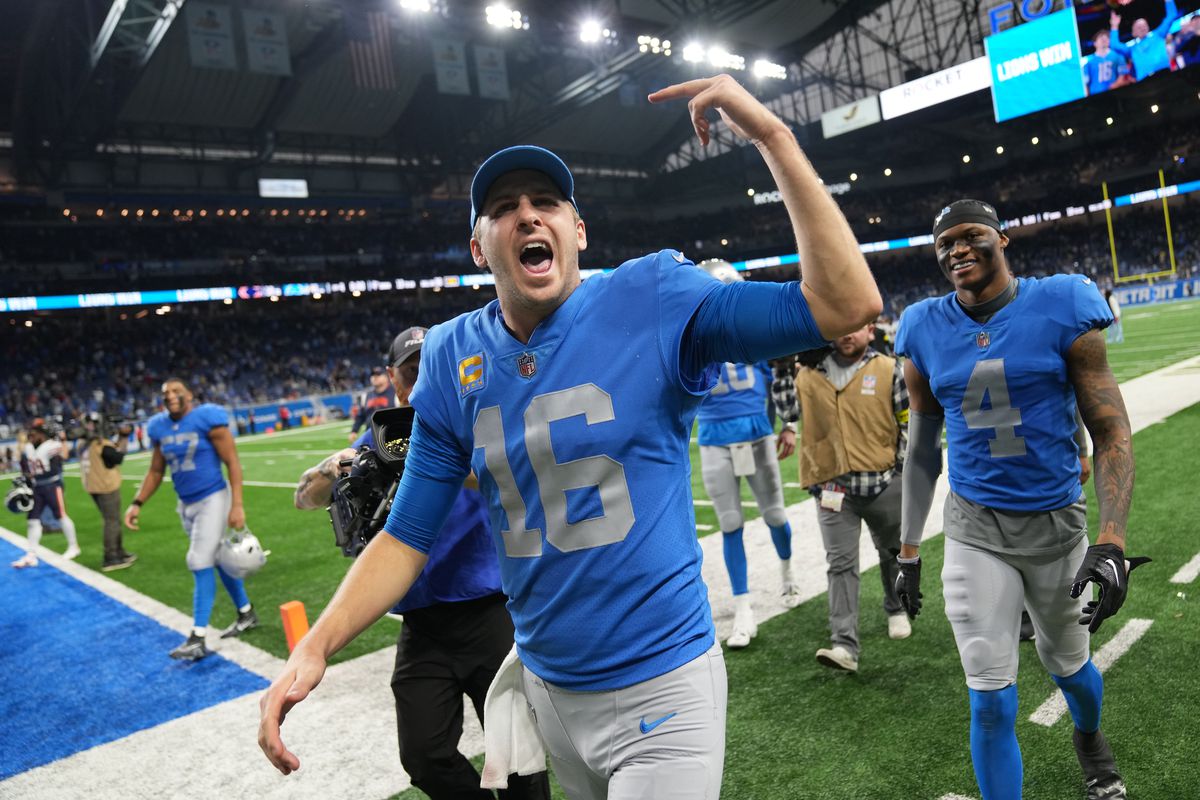 Jared Goff #16 of the Detroit Lions celebrates as they walk off the field after a win over the Chicago Bears at Ford Field on January 01, 2023 in Detroit, Michigan.
