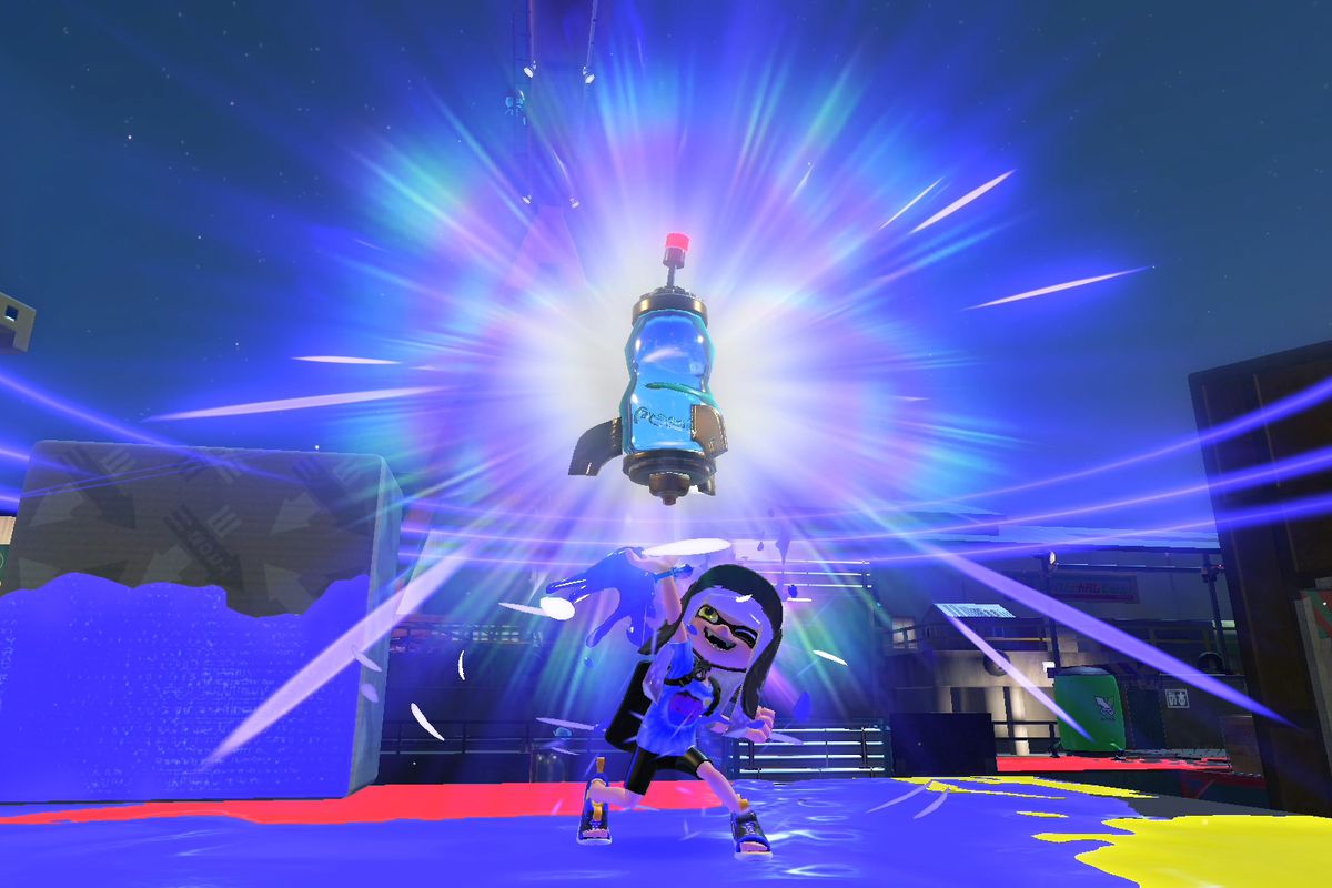 An inkling holds a trophy while standing on a stage in Splatoon 3’s ranked mode.