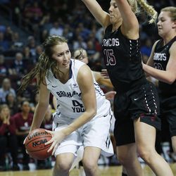 Brigham Young Cougars forward Amanda Wayment (4) looks to pass around Santa Clara Broncos forward Marie Bertholdt (15) during the WCC tournament in Las Vegas Monday, March 7, 2016. BYU won 87-67.