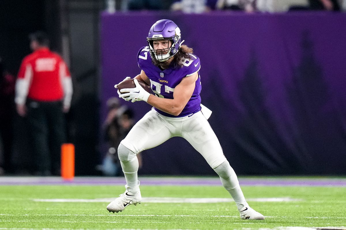 Minnesota Vikings tight end T.J. Hockenson (87) carries the ball during the second quarter against the Dallas Cowboys at U.S. Bank Stadium.