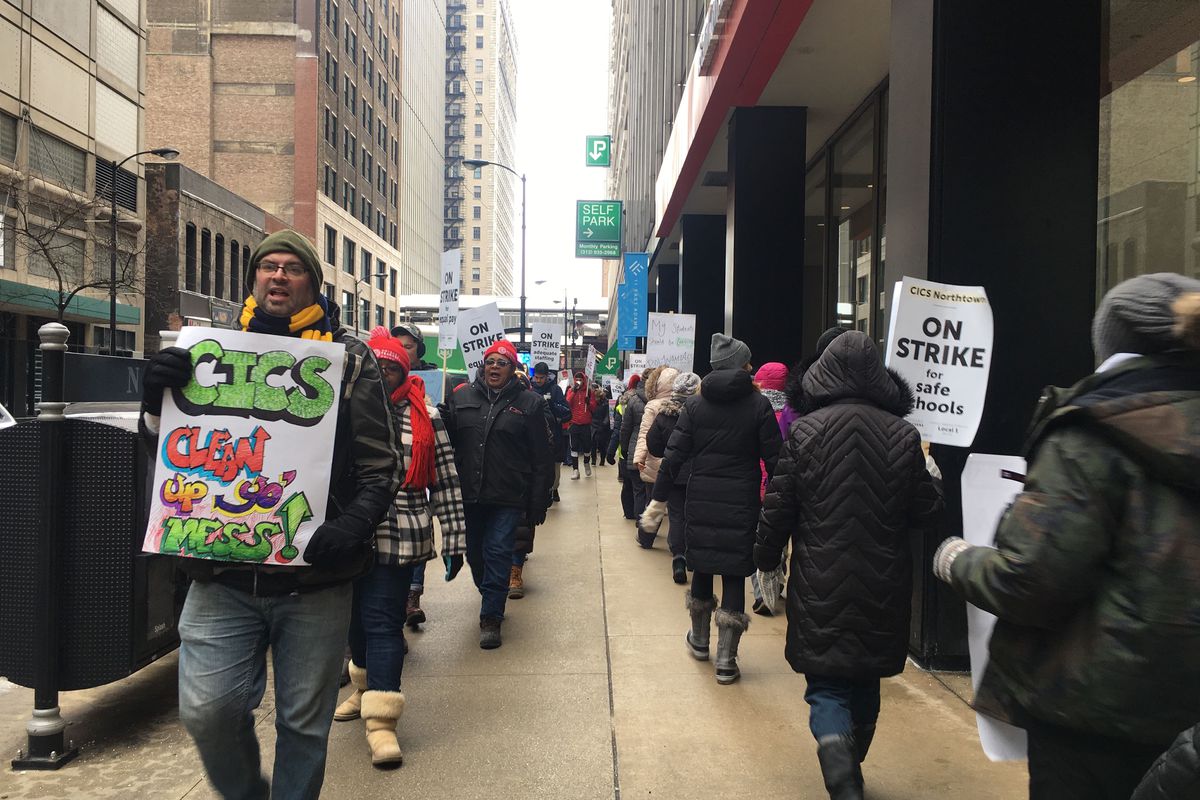 Teachers and supporters march in front of Chicago International Charter Schools' corporate offices on the fifth day of the strike.