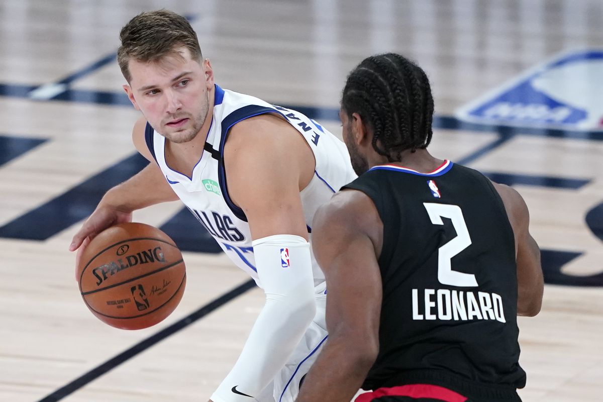 Luka Doncic of the Dallas Mavericks is defended by Kawhi Leonard of the LA Clippers during the second half in game two of the first round of the NBA playoffs at AdventHealth Arena at ESPN Wide World Of Sports Complex on August 19, 2020 in Lake Buena Vista, Florida.