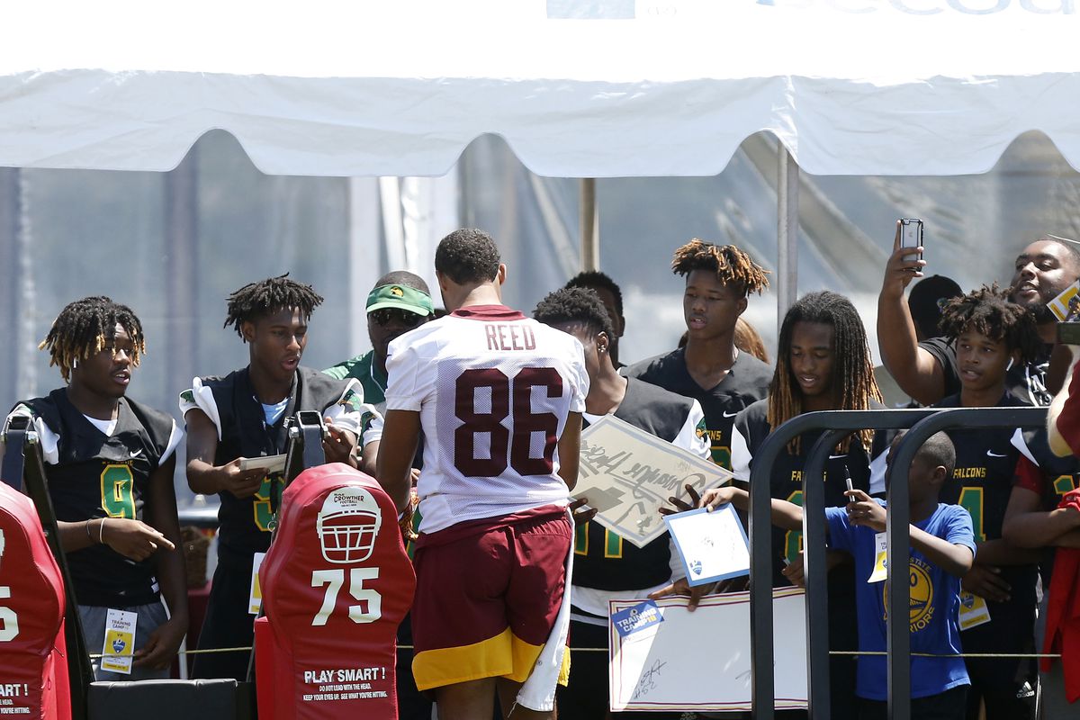 Washington tight end Jordan Reed (86) signs autographs for fans after practice on day one of training camp at Bon Secours Washington Redskins Training Center.