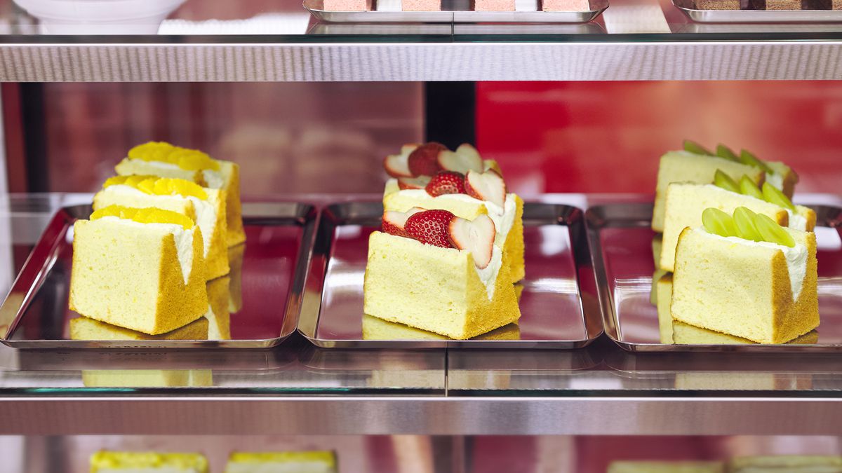 Slices of cake at a bakery counter. 