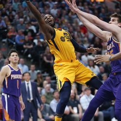 Utah Jazz forward Jae Crowder (99) drives on Phoenix Suns forward Alan Williams (15) in Salt Lake City on Thursday, March 15, 2018. The Jazz 116-88.