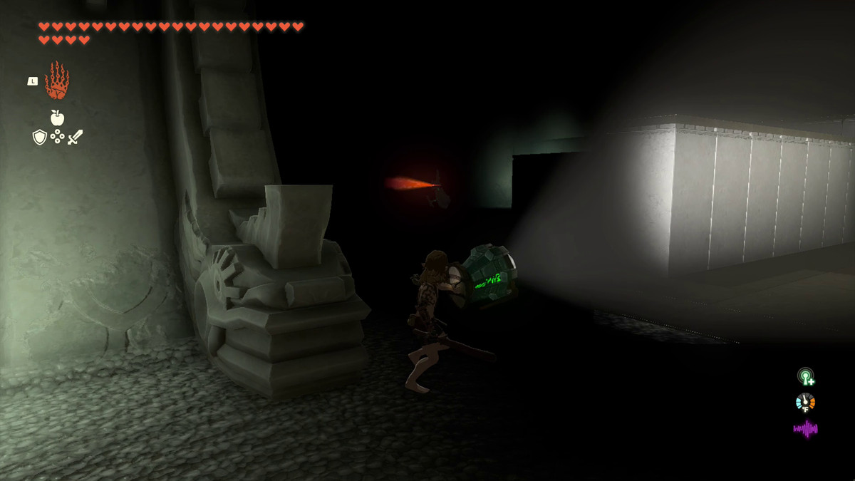 Link uses the Shield of Light to cast a beam into the darkness of Simosiwak Temple;  To his left, a Construction soldier patrols with a red eye as its only light