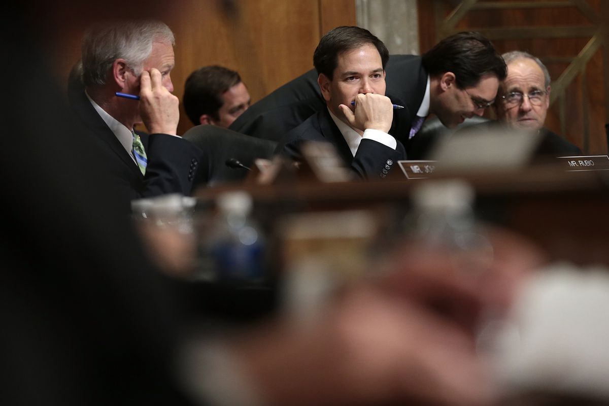  Sen. Marco Rubio (R-FL), a Republican presidential candidate, listens to opening remarks during a markup meeting of the Senate Foreign Relations Committee on the proposed nuclear deal with Iran. 