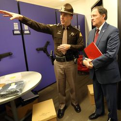 Utah Highway Patrol Lt. Jeff Nigbur shows Gov. Gary Herbert where they store evidence during a tour of the Utah Highway Patrol's headquarters in Murray on Wednesday, Dec. 7, 2016.