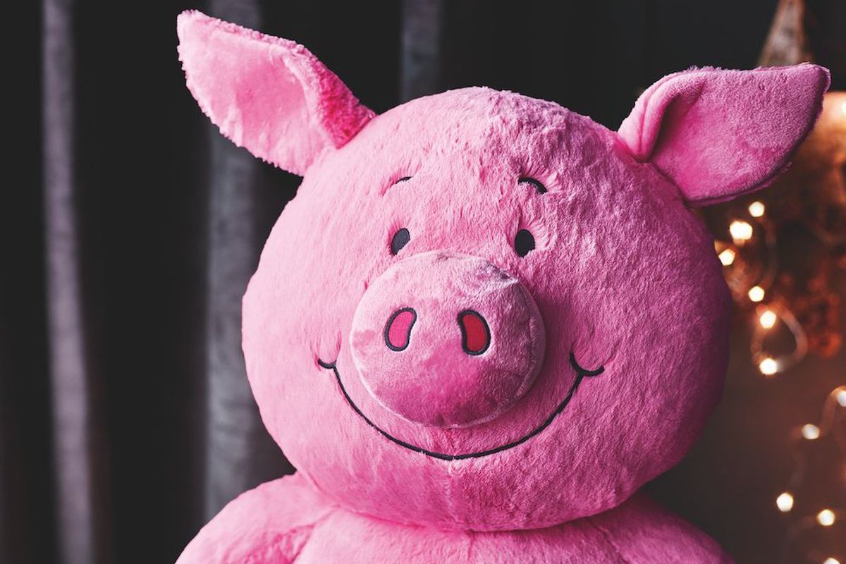 A stuffed Percy Pig toy’s face, based on the Percy Pig sweet
