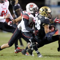 Utah Utes defensive back Dominique Hatfield (15) tackles Colorado Buffaloes defensive back Isaiah Oliver (26) during a football game at Folsom Field in Boulder, Colo., on Saturday, Nov. 26, 2016.