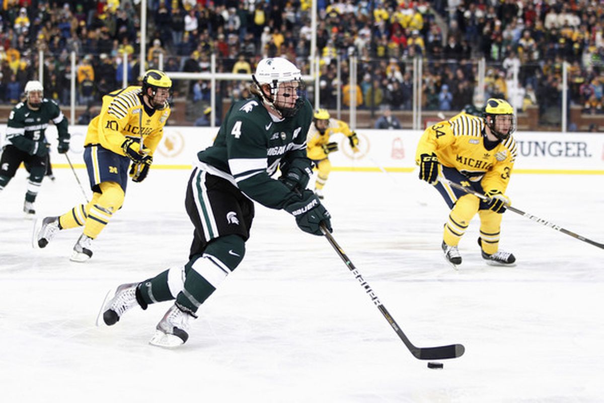 ANN ARBOR MI - DECEMBER 11:  Trevor Nill #4 of the Michigan State Spartans heads up ice while playing the Michigan Wolverines at Michigan Stadium on December 11 2010 in Ann Arbor Michigan.  (Photo by Gregory Shamus/Getty Images)