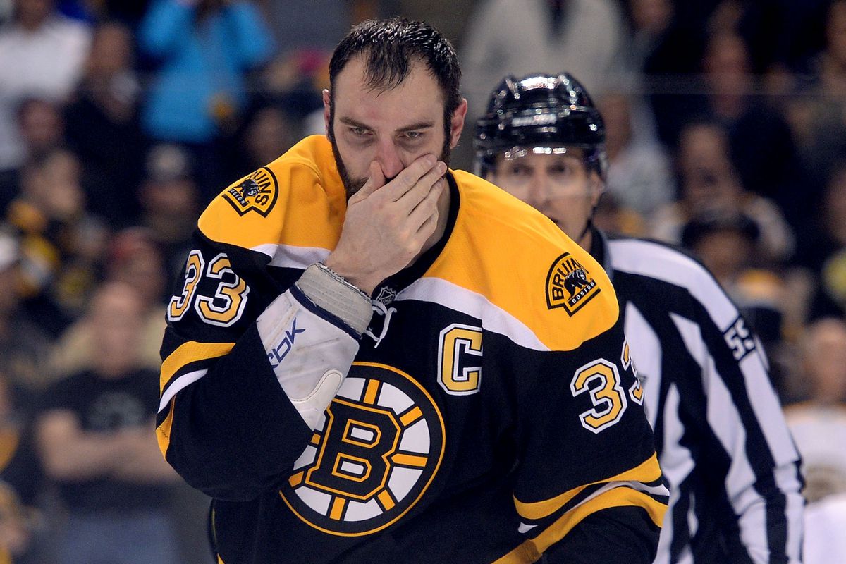 Zdeno Chara feels shame as he is escorted to the penalty box.