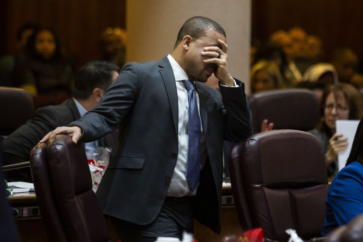 Ald. Michael Scott Jr. (24th) holds his head during a contentious Chicago City Council meeting at City Hall, Wednesday, Dec. 18, 2019.