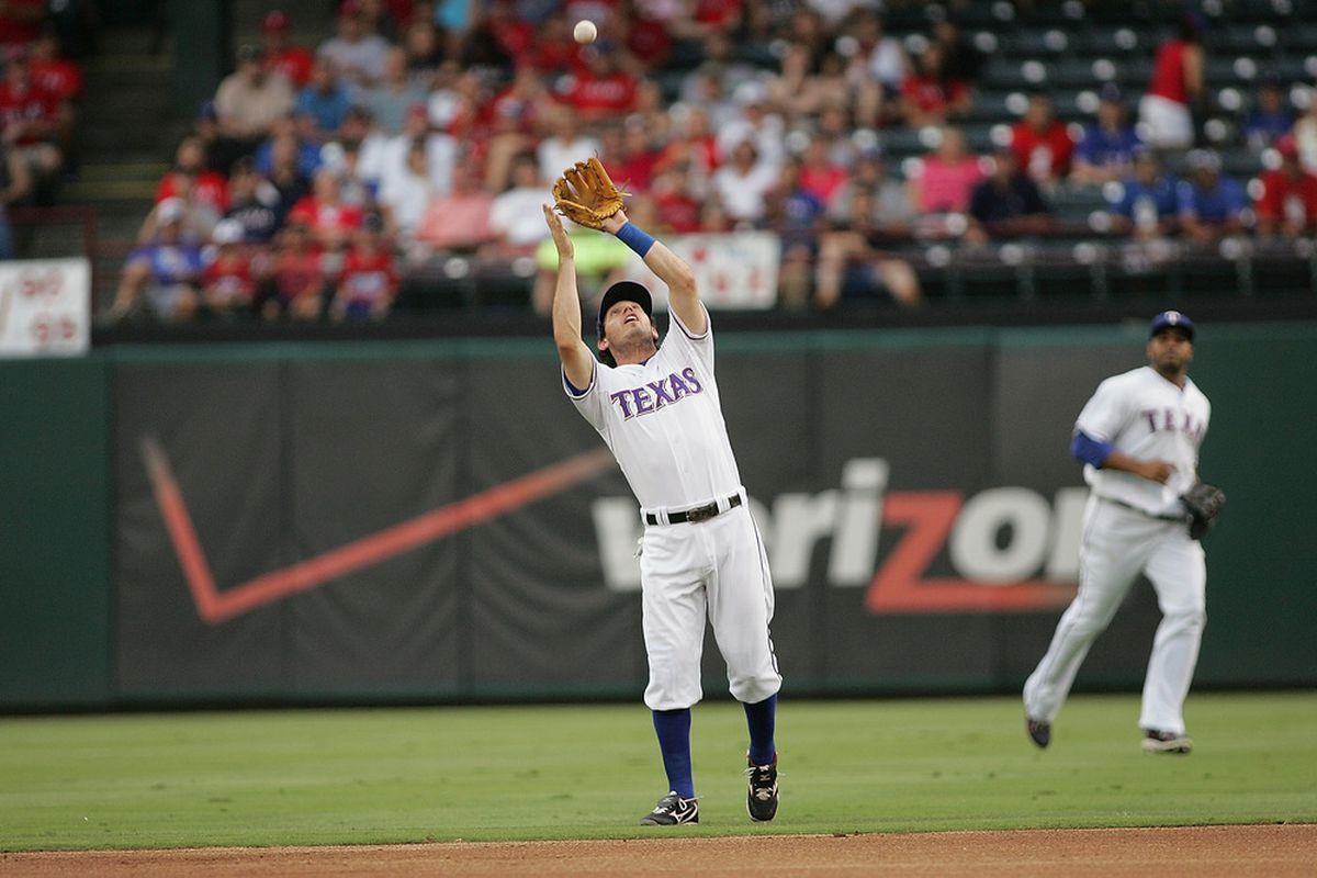 ARLINGTON, TX - JUNE 20:  Ian Kinsler #5 of the Texas Rangers catches a pop fly during the game against the Houston Astros at Rangers Ballpark in Arlington on June 20, 2011 in Arlington, Texas.  (Photo by Rick Yeatts/Getty Images)