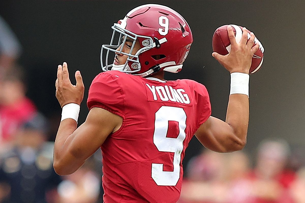 Bryce Young of the Alabama Crimson Tide looks to pass against the Mississippi Rebels during the second half at Bryant-Denny Stadium on October 02, 2021 in Tuscaloosa, Alabama.