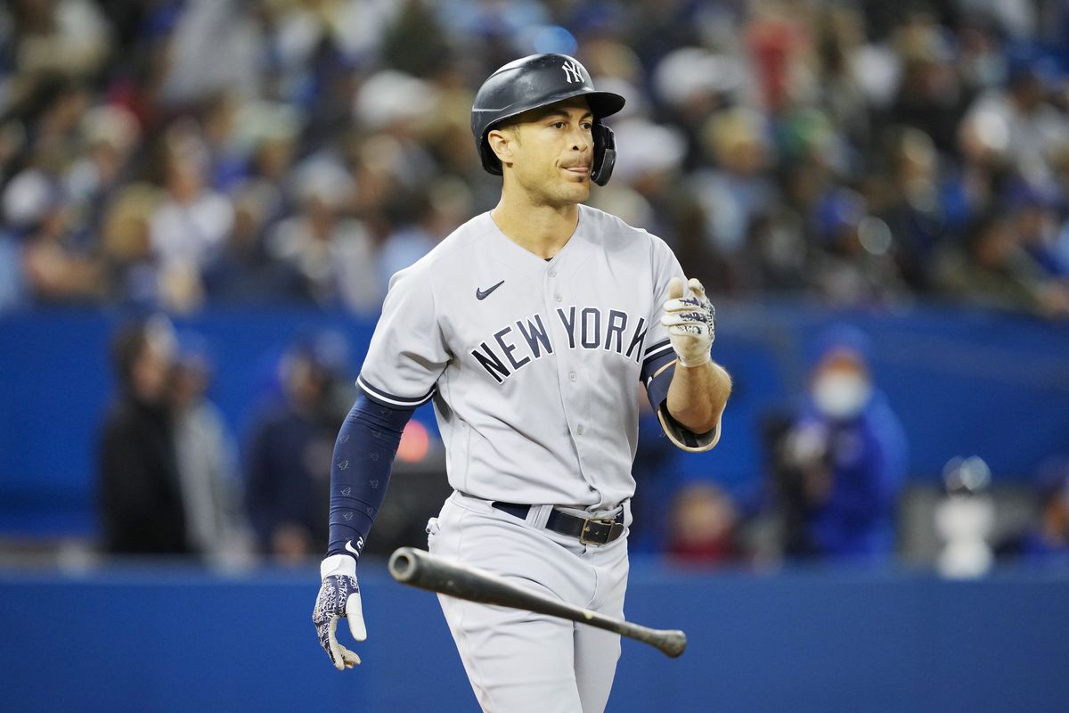 Giancarlo Stanton of the New York Yankees flips the bat after hitting a three-run home run against the Toronto Blue Jays in the seventh inning at the Rogers Centre on September 28, 2021 in Toronto, Ontario, Canada.