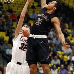 Lone Peak's Frank Jackson dunks the ball over American Fork's Spencer Johnson during boys high school basketball at Utah Valley University in Orem, Tuesday, Feb. 10, 2015.
