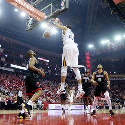 Utah Jazz center Rudy Gobert (27) puts down a dunk as the Utah Jazz and the Houston Rockets play game two of the NBA playoffs at the Toyota Center in Houston on Wednesday, May 2, 2018.