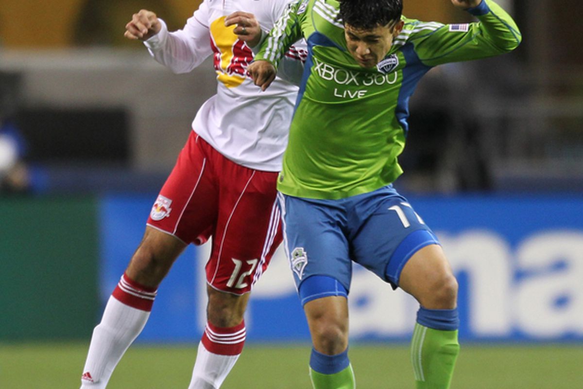 SEATTLE - APRIL 03:  Mike Petke #12 of the New York Red Bulls  battles Fredy Montero #17 of  the Seattle Sounders FC on April 3, 2010 at Qwest Field in Seattle, Washington. (Photo by Otto Greule Jr/Getty Images)