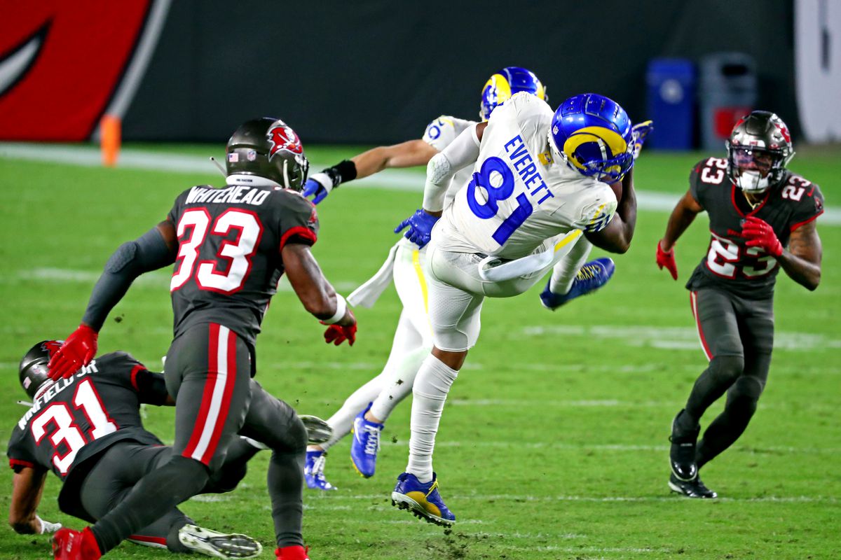 Los Angeles Rams tight end Gerald Everett (81) runs the ball against Tampa Bay Buccaneers free safety Jordan Whitehead (33) during the third quarter at Raymond James Stadium.