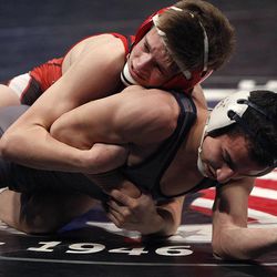 Cameron Hunsaker of American Fork, top, and Braxton Ocana of Layton compete at the 5A State Wrestling Championships at UVU in Orem Thursday, Feb. 12, 2015.