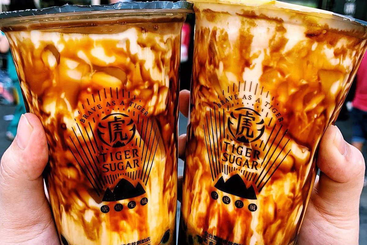 Two cups of striped brown sugar bubble tea from Tiger Sugar, coming soon to Henderson.