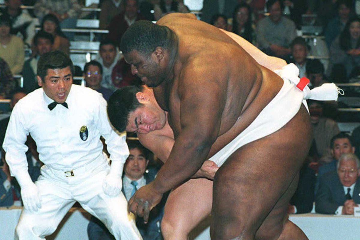 Emanuel Yarbrough, right, competed in sumo wrestling, the UFC and professional wrestling.