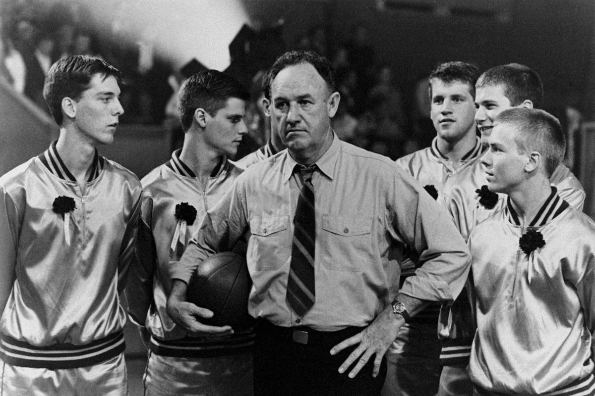 Gene Hackman surrounded by young basket players