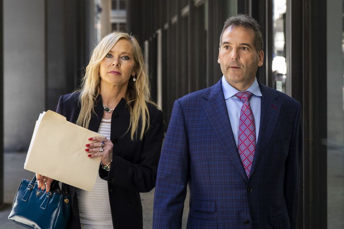 Vincent DelGiudice, right, walks with his attorney, Carolyn Gurland, out of the Dirksen Federal Courthouse in March 2020.