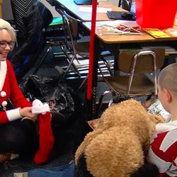 Sophomore Brenna McCoy was among the Viewmont High School students who delivered gifts to kids at Vae View Elementary School in Layton on Wednesday, Dec. 21, 2016.