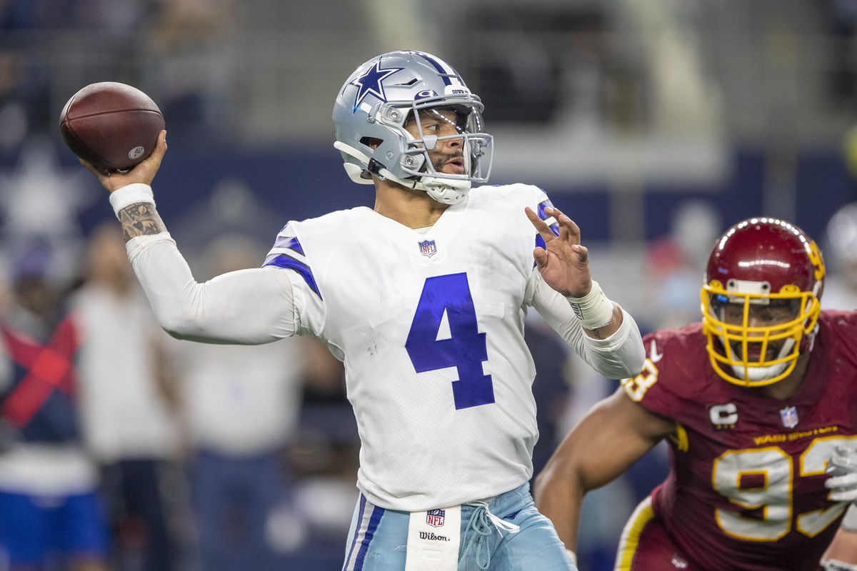 Dak Prescott #4 of the Dallas Cowboys throws a pass during a game against the Washington Football Team at AT&amp;T Stadium on December 26, 2021 in Arlington, Texas. The Cowboys defeated the Football Team 56-14.