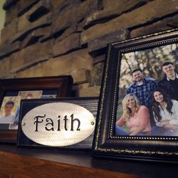 Family pictures fill the mantle at the Wride household as Nanette Wride, wife of fallen Utah County Sgt. Cory Wride, shared some of her fond memories of Cory at her home on Sunday, February 2, 2014.