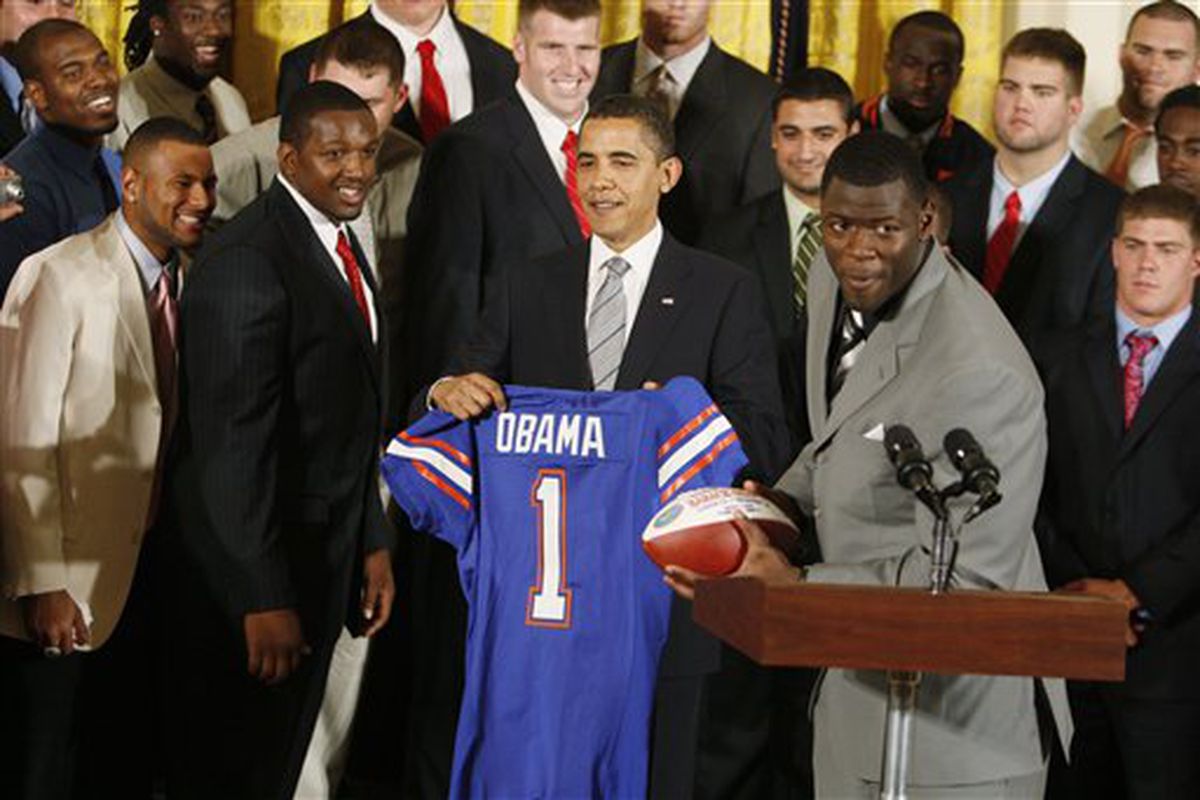 Eagles Rookie TE Cornelius Ingram(on the right) presents a jersey to the President.