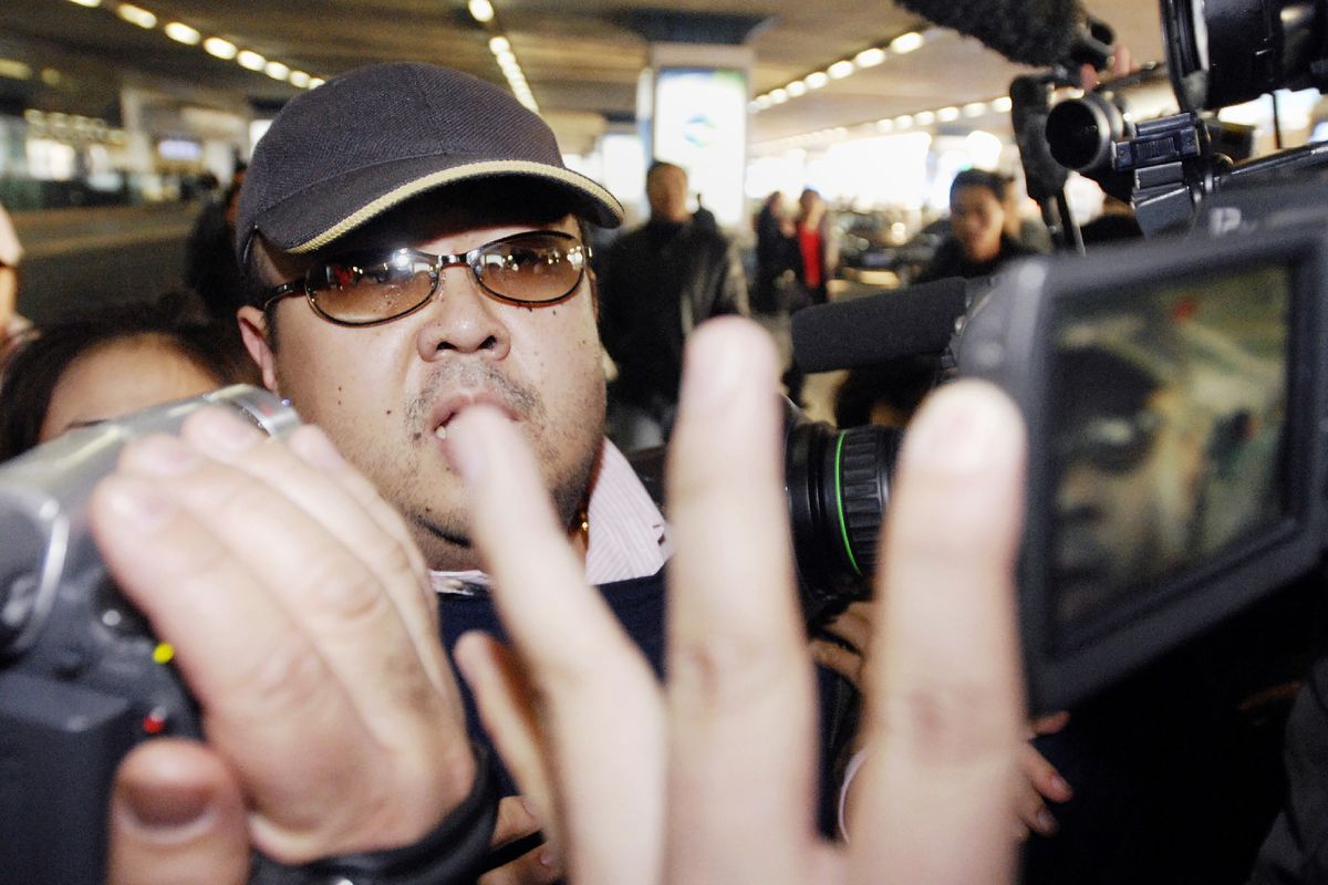 Kim Jong Nam walking among journalists at Beijing’s international airport in 2007.