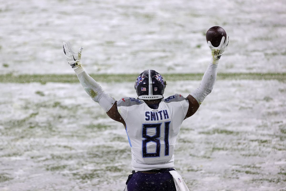 Tight end Jonnu Smith #81 of the Tennessee Titans celebrates a touchdown reception against the Green Bay Packers during the second quarter at Lambeau Field on December 27, 2020 in Green Bay, Wisconsin.