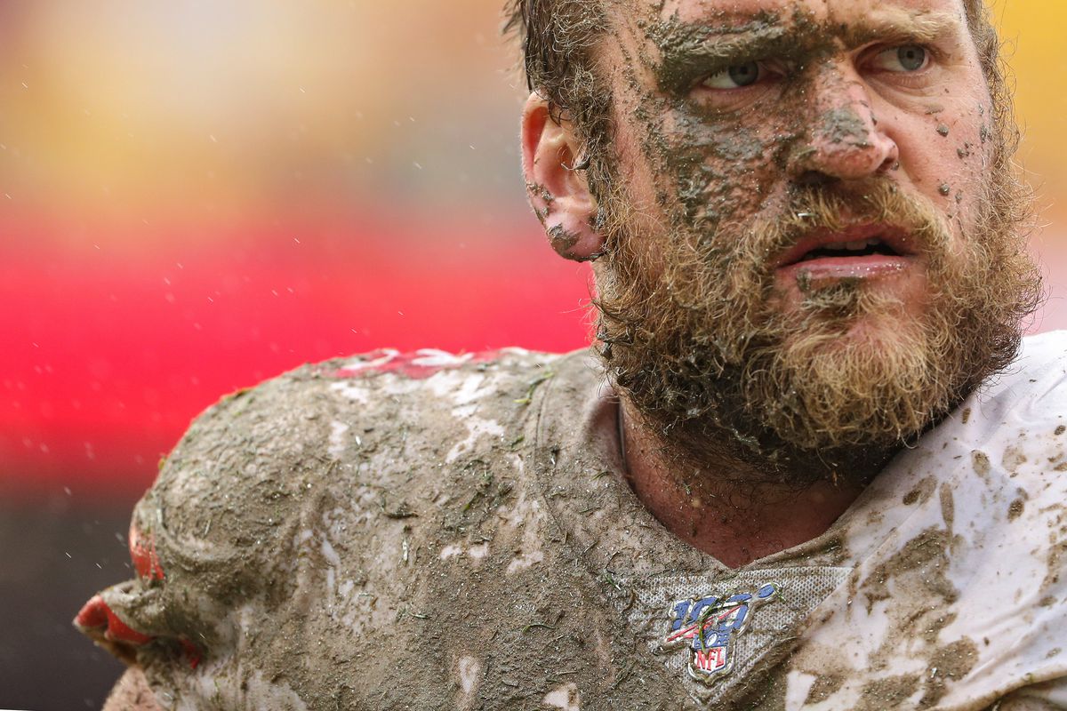 Covered in mud, offensive guard Mike Person of the San Francisco 49ers looks on after making a tackle on Washington defensive back Troy Apke during the third quarter at FedExField on October 20, 2019 in Landover, Maryland.