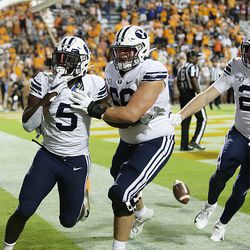 Brigham Young Cougars running back Ty’Son Williams (5) celebrates the win with teammates as BYU and Tennessee play a game in Knoxville on Saturday, Sept. 7, 2019. BYU won 29-26 in double overtime.