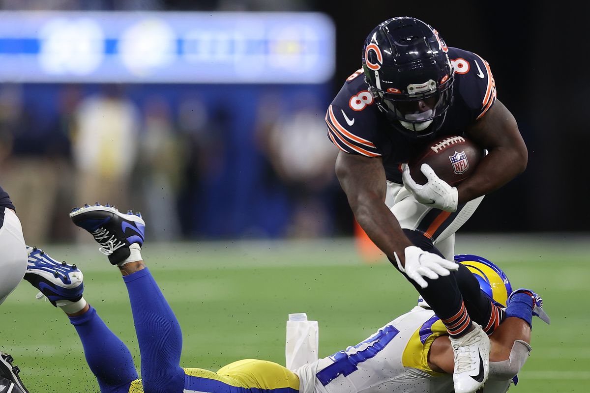 Damien Williams #8 of the Chicago Bears is brought down by Taylor Rapp #24 of the Los Angeles Rams during the second half at SoFi Stadium on September 12, 2021 in Inglewood, California.