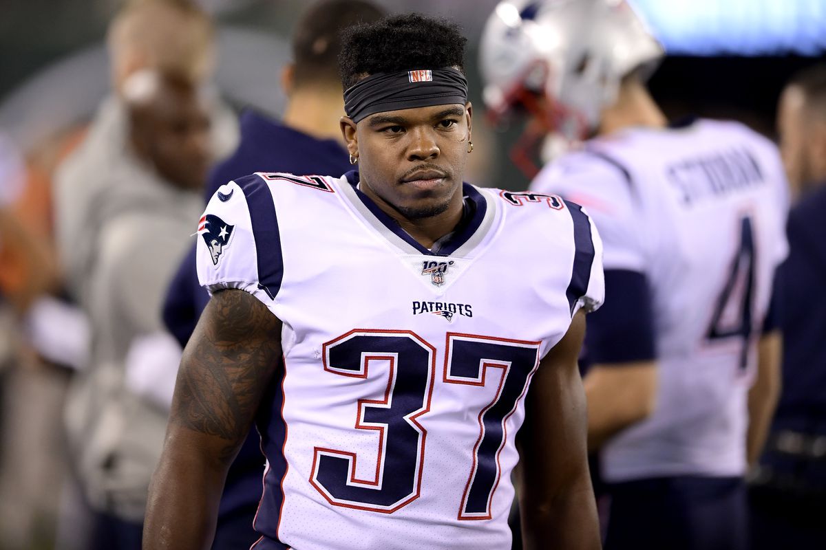 Damien Harris of the New England Patriots looks on against the New York Jets at MetLife Stadium on October 21, 2019 in East Rutherford, New Jersey.