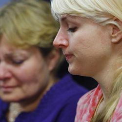 Karen Evans and her mother, Tara, listen to a press conference at Ogden's McKay-Dee Hospital Center as they talk about the condition of their husband and father, James Evans, Monday, June 17, 2013. Police say James Evans was shot in the head by Charles Richard Jennings Jr. while attending Mass at St. James Catholic Church in Ogden.