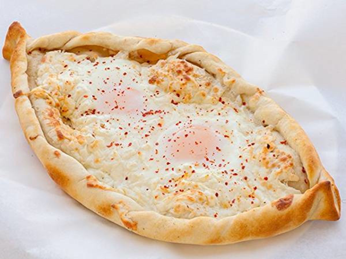 Khachapuri from Sipan Bakery on a paper sheet.