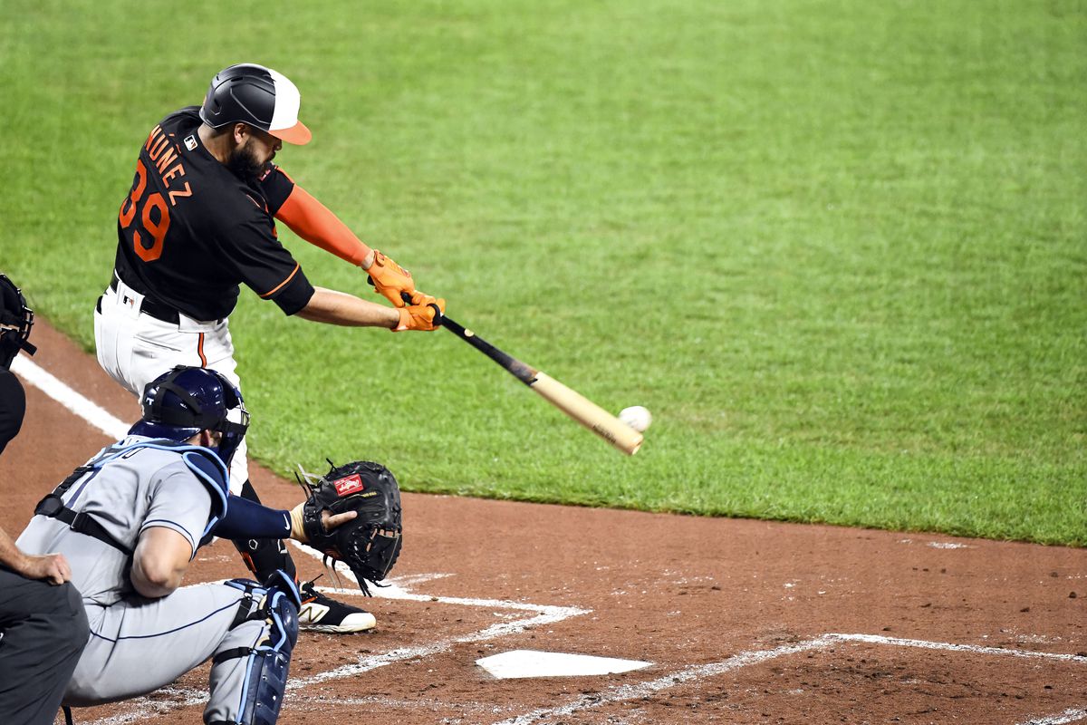 Baltimore Orioles designated hitter Renato Nunez (39) hits a single during the game against Tampa Bay Rays on July 31, 2020, at Orioles Park at Camden Yards, in Baltimore, MD.