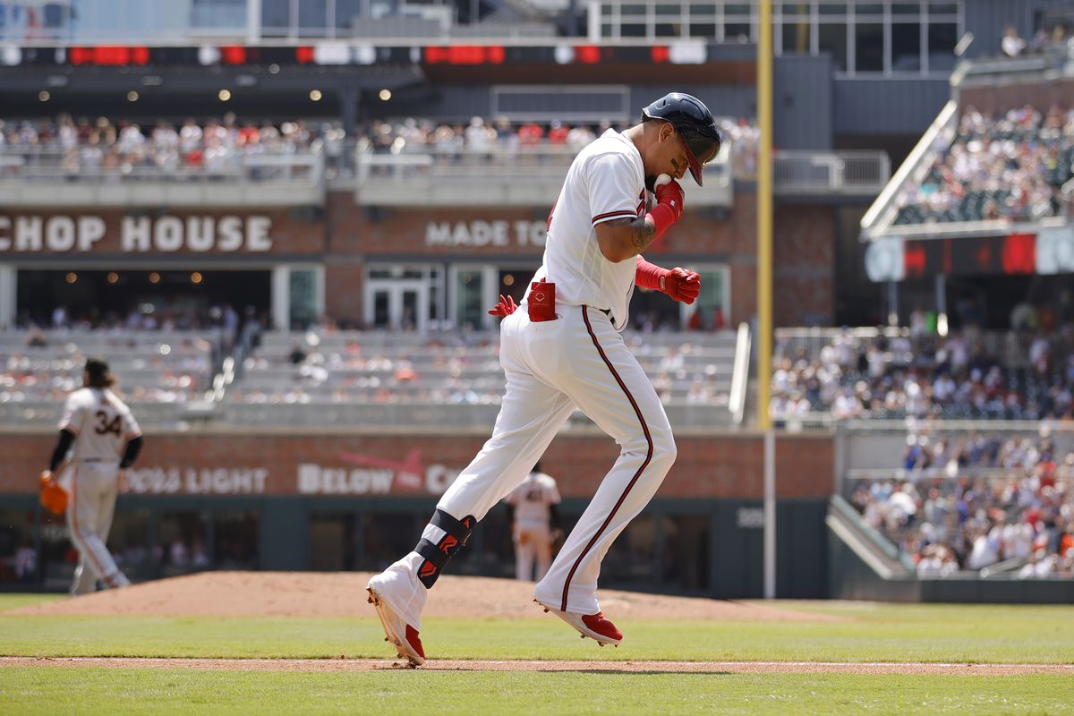 Orlando Arcia of the Atlanta Braves celebrates a two-run home run during the second inning against the San Francisco Giants at Truist Park on August 20, 2023 in Atlanta, Georgia.