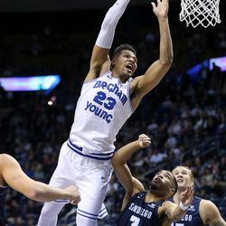 Brigham Young Cougars forward Yoeli Childs (23) goes for the hoop over San Diego Toreros guard Joey Calcaterra (2) and forward Alex Floresca (15) at the Marriott Center in Provo on Saturday, Jan. 20, 2018.