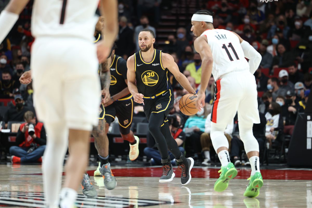 Golden State Warriors guard Stephen Curry (30) brings the ball up court in the second half against the Portland Trail Blazers at Moda Center.