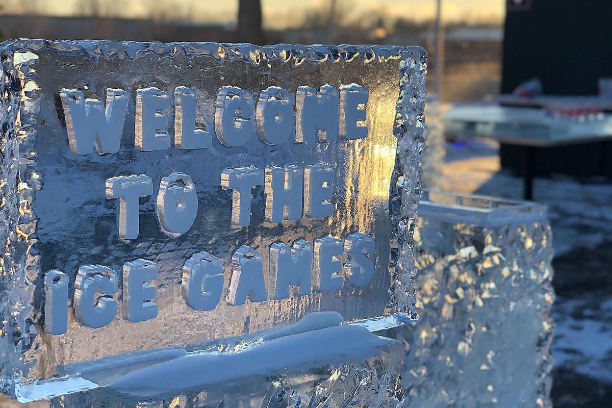 A sign made completely of ice reads Welcome to the Ice Games.