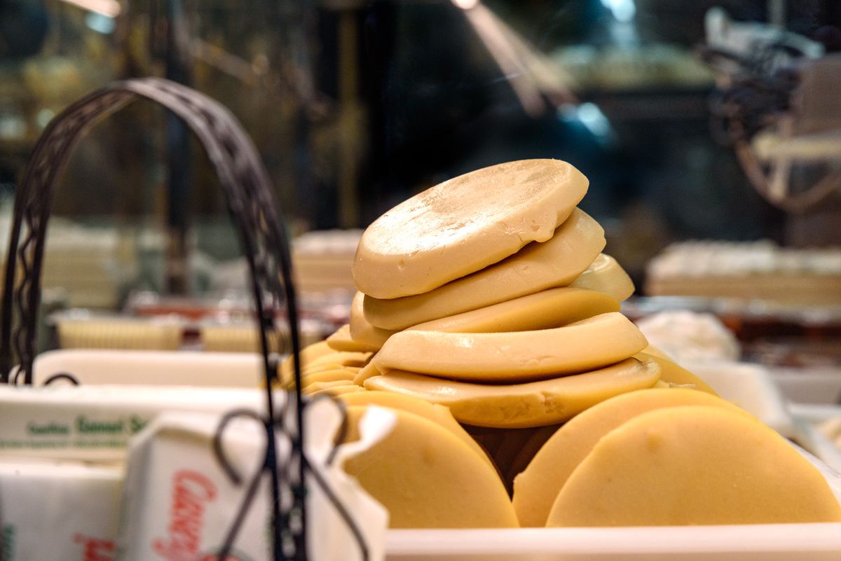 Circular wedges of dough stacked on a countertop.