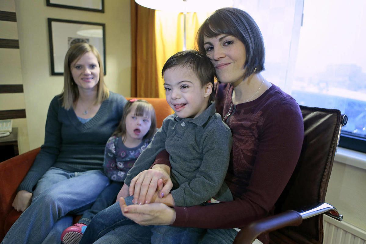 Jeana Bonner, left, of South Jordan, Utah, and Rebecca Preece from Nampa, Idaho, sit with their adopted children at a hotel in Moscow, Russia, Saturday, Feb. 9, 2013. After weeks of anxiety, plodding through the opaque Russian legal system and suffering w