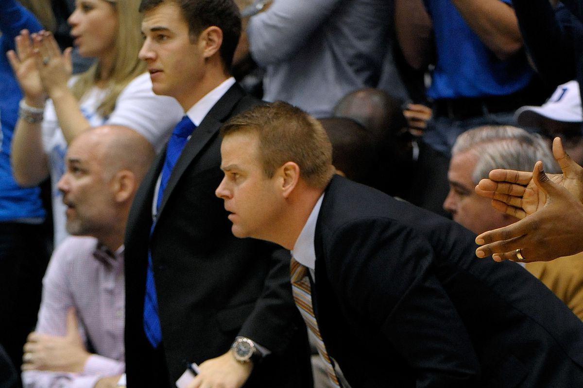Assistant coaches Steve Wojciechowski and Jeff Capel of the Duke Blue Devils watch their team play defense against the Michigan Wolverines during play at Cameron Indoor Stadium on December 3, 2013 in Durham, North Carolina. Duke won 79-69