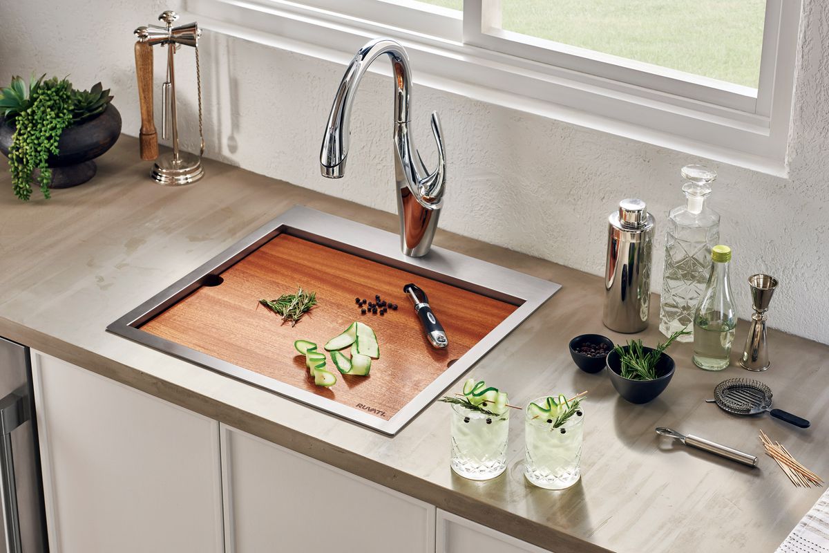 Sink with a built in cutting board